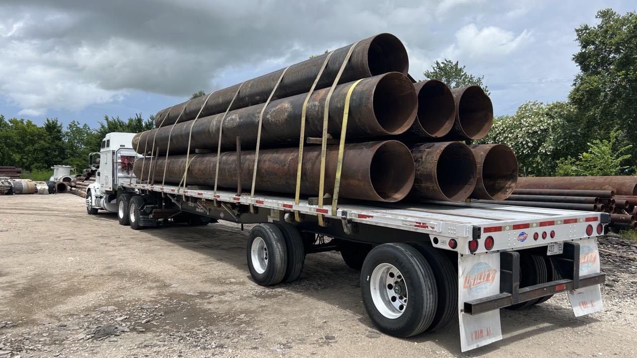 Recovered pipe loaded for haul