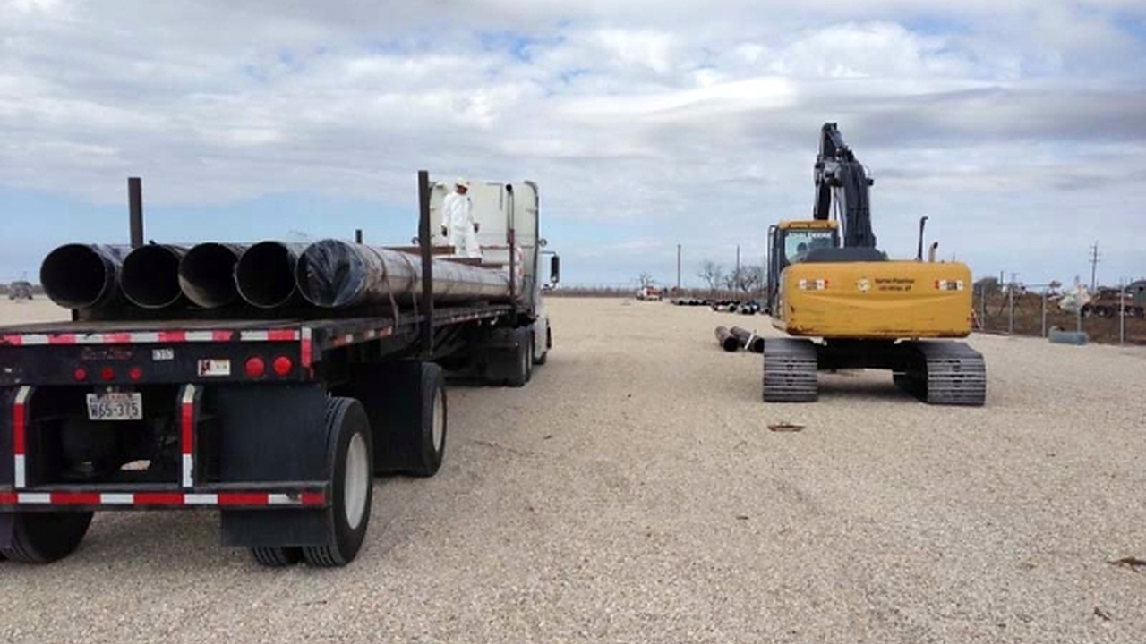 Recovered pipe loaded for haul